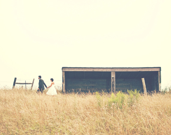 Wedding couple in grass field