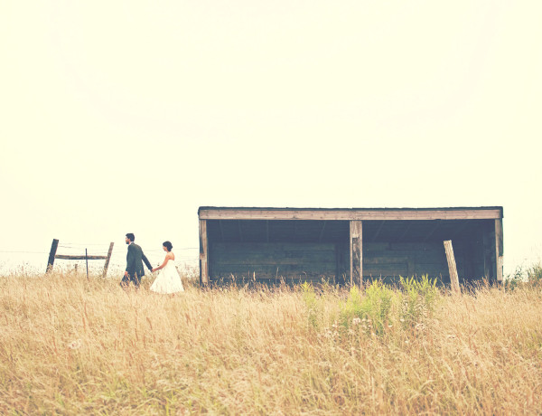 Wedding couple in grass field