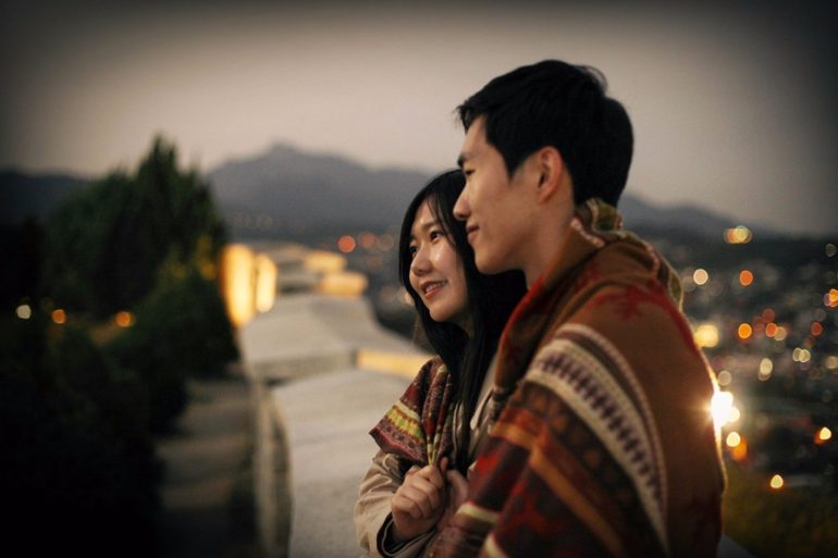Korean couple photoshoot watching sunset