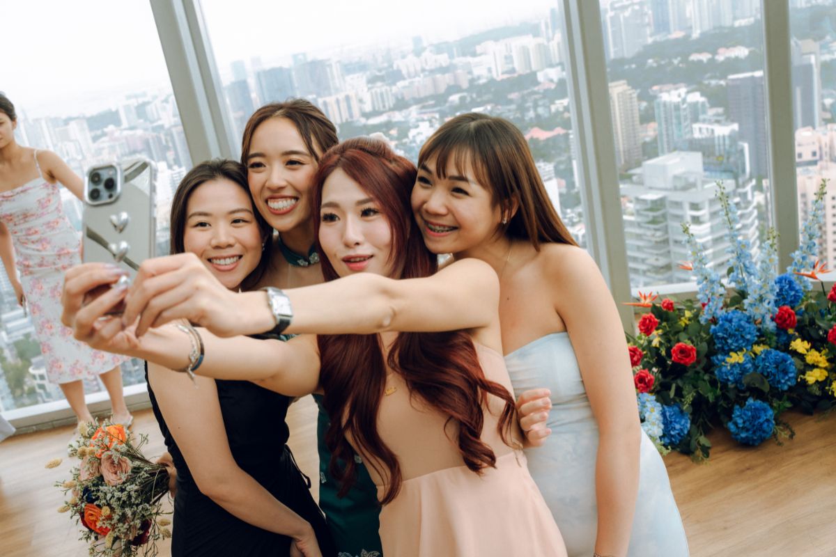 Guests are taking selfies in a wedding banquet