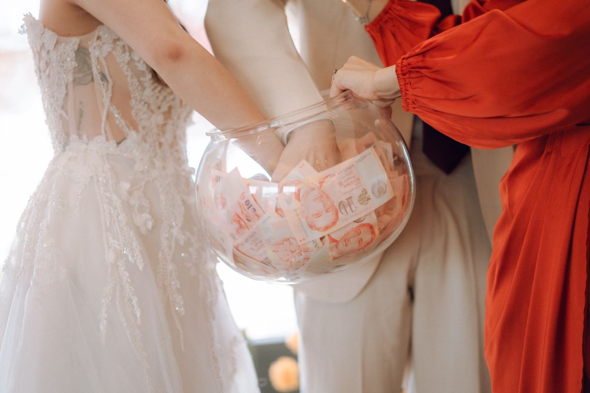 Wedding couple drawing a $10 note from a fishbowl during a banquet game