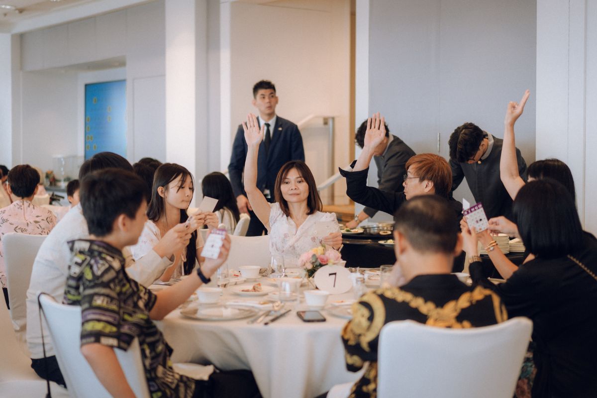 Guests are playing bingo during a lively wedding celebration