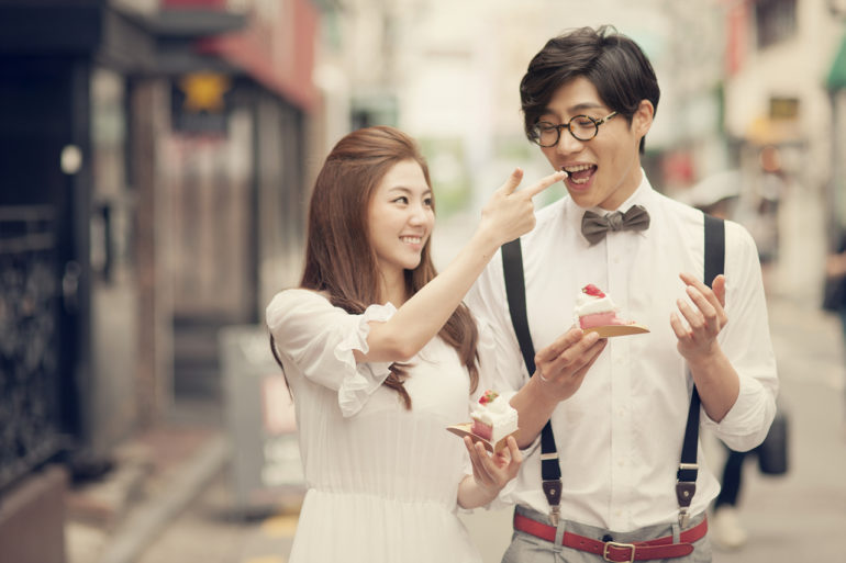 Young Fashion Couple Posing In Studio Man Stroking Womans Hair Stock Photo  - Download Image Now - iStock