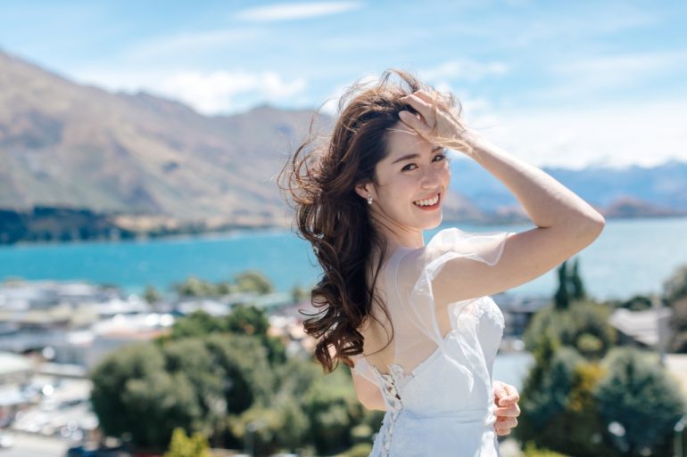 bride pushes back her hair