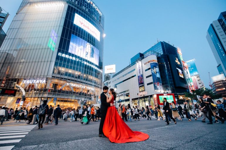 bride in bright red gown on tokyo streets