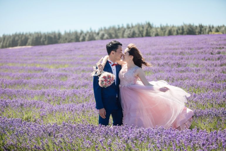 bride in pink flowy dress in lavender fields