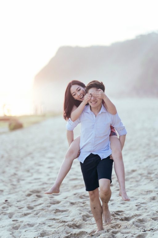 wedding photography poses groom carries bride on his back