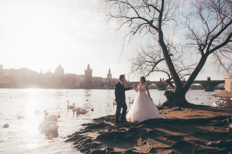 wedding photography prague river vltava charles bridge swans