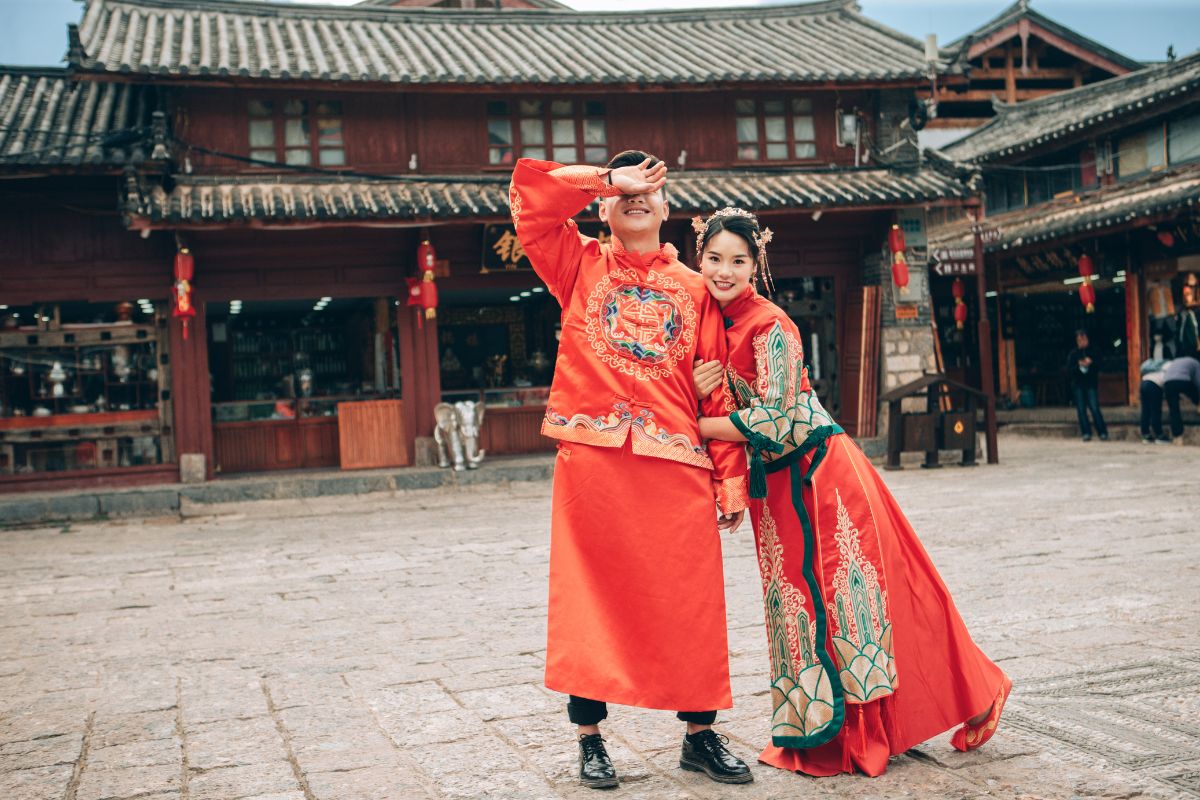 Couple wearing traditional attire for their pre-wedding photoshoot in an ancient town in Yunnan