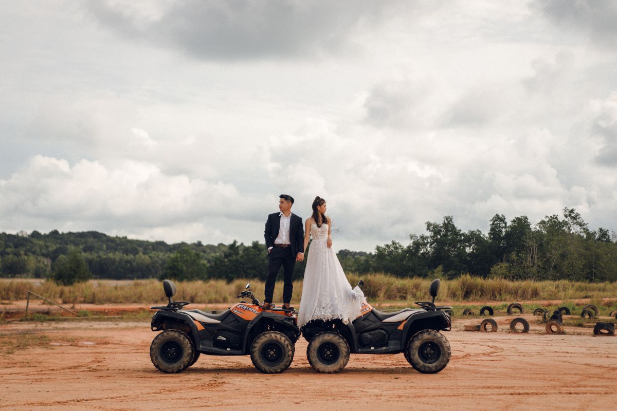 Couple standing on an ATV during their pre-wedding photoshoot in Bintan