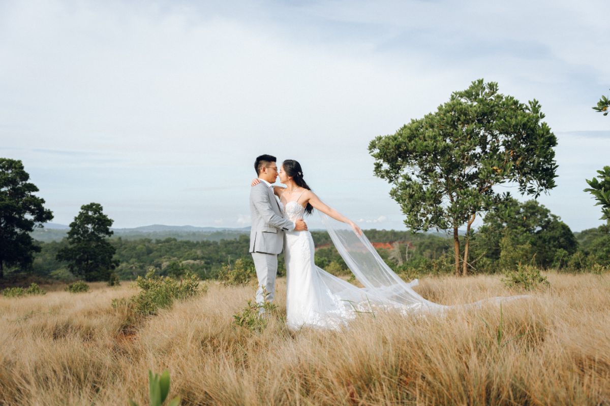 Couple having a pre-wedding photoshoot at the Bintan savannah grasslands